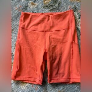 Athleta Orange Ultimate Stash Pocket 7” Athletic Biker Shorts Size Small